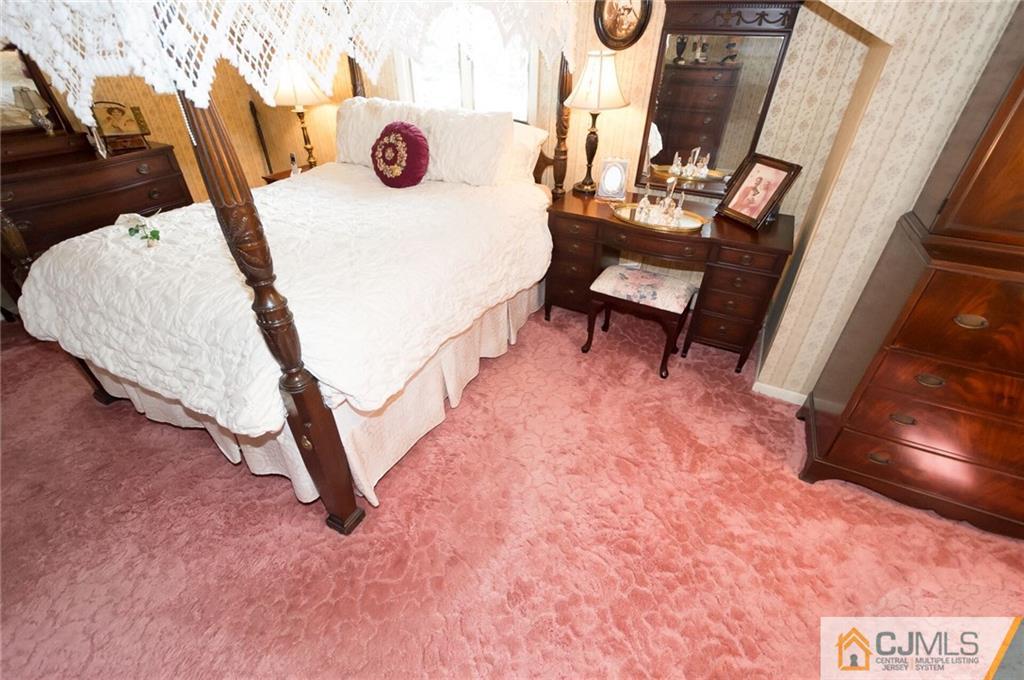 5 Utica Road Edison, NJ 08820 - Photo 28 of 48 a view of a room with furniture and wooden floor