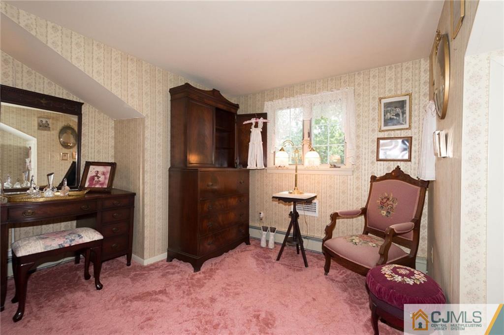 5 Utica Road Edison, NJ 08820 - Photo 29 of 48 a living room with furniture and a window