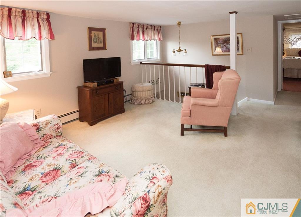 5 Utica Road Edison, NJ 08820 - Photo 31 of 48 a bedroom with a bed and flat screen tv