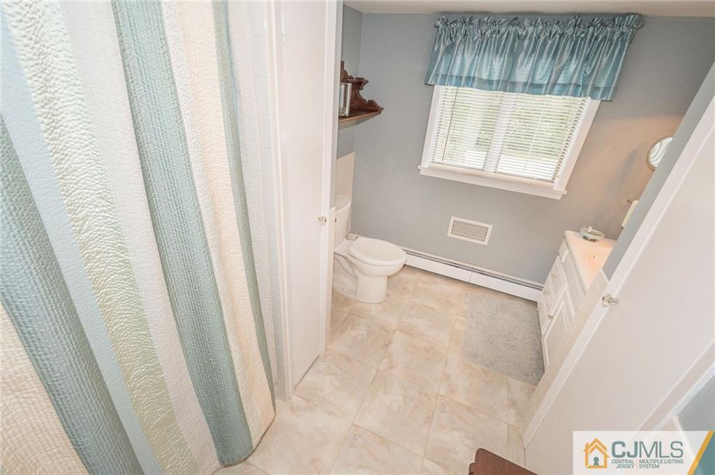 5 Utica Road Edison, NJ 08820 - Photo 32 of 48 a view of an empty room with a window