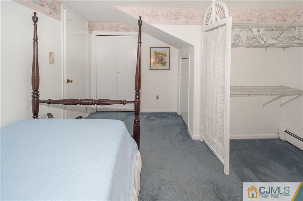 5 Utica Road Edison, NJ 08820 - Photo 36 of 48 a bedroom with a bed and a view of hallway