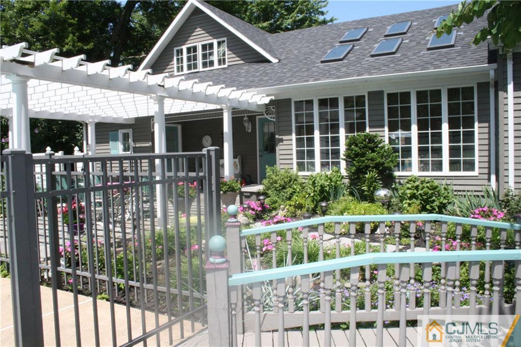 5 Utica Road Edison, NJ 08820 - Photo 38 of 48 a front view of a house with plants