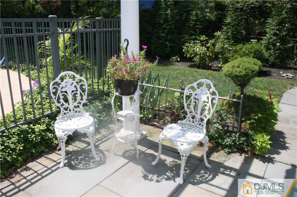 5 Utica Road Edison, NJ 08820 - Photo 39 of 48 a view of a fountain with flower plants