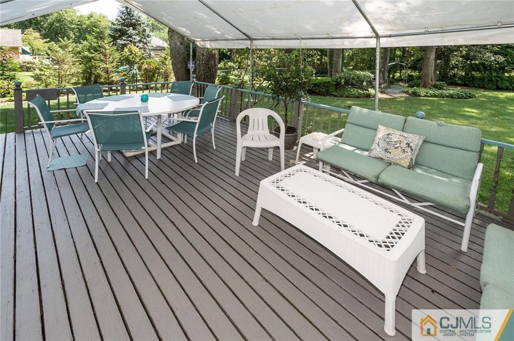 5 Utica Road Edison, NJ 08820 - Photo 44 of 48 a view of a patio with table and chairs and potted plants