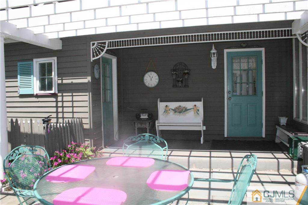 5 Utica Road Edison, NJ 08820 - Photo 45 of 48 a front view of a house with chairs