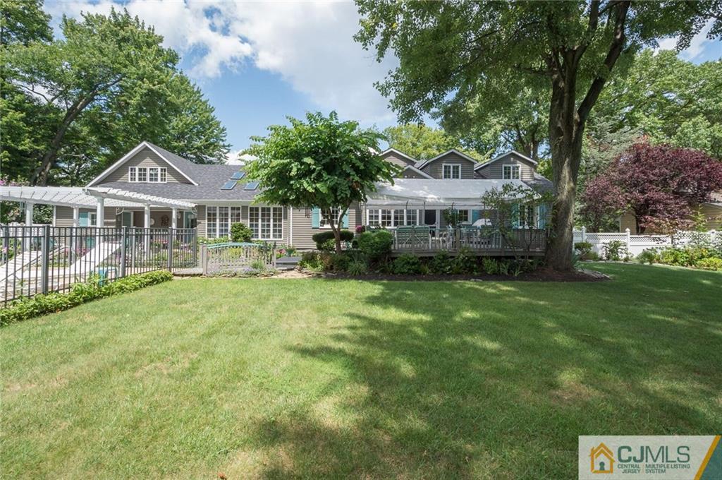 5 Utica Road Edison, NJ 08820 - Photo 47 of 48 a front view of a house with a garden and lake view