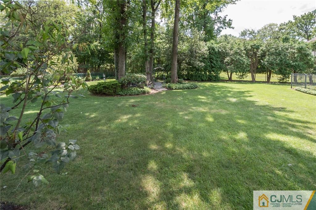 5 Utica Road Edison, NJ 08820 - Photo 48 of 48 a view of outdoor space with a garden and trees