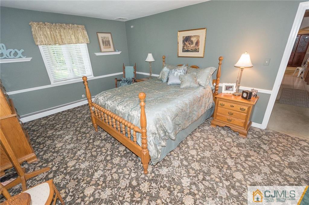 5 Utica Road Edison, NJ 08820 - Photo 6 of 48 a bedroom with a bed and a window
