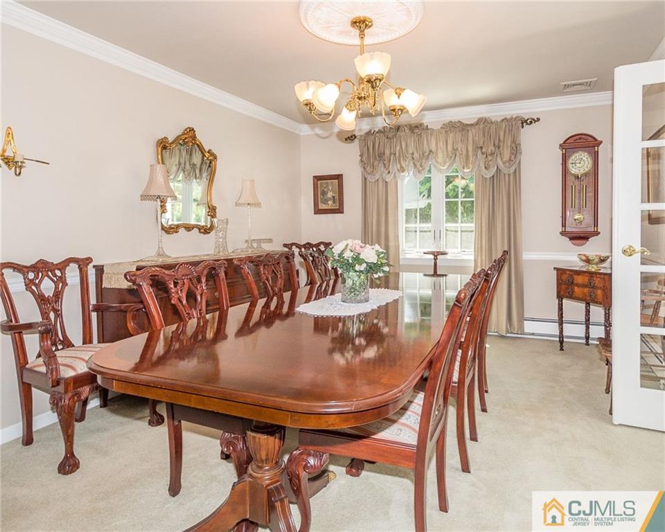 5 Utica Road Edison, NJ 08820 - Photo 8 of 48 a view of a dining room with furniture and chandelier