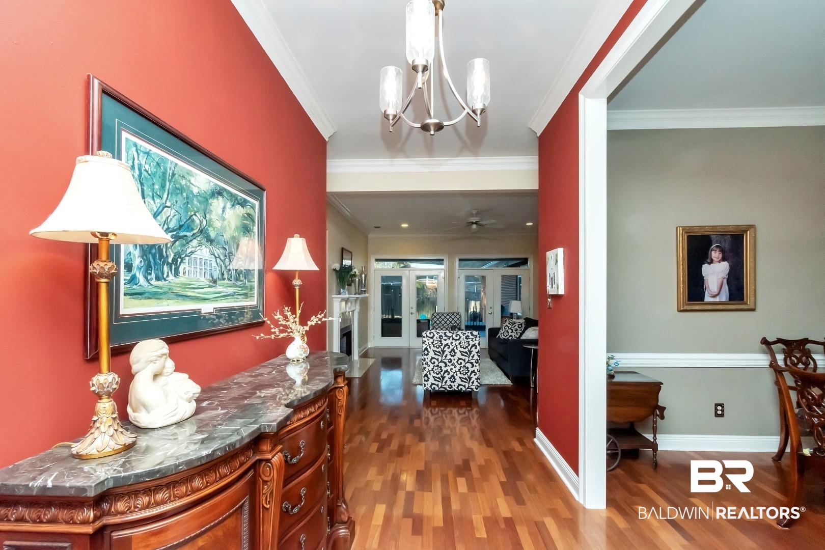 1050 Southern Way Court Mobile, AL 36609 - Photo 2 of 36 Hallway with ornamental molding, dark wood-type flooring, a chandelier, and french doors