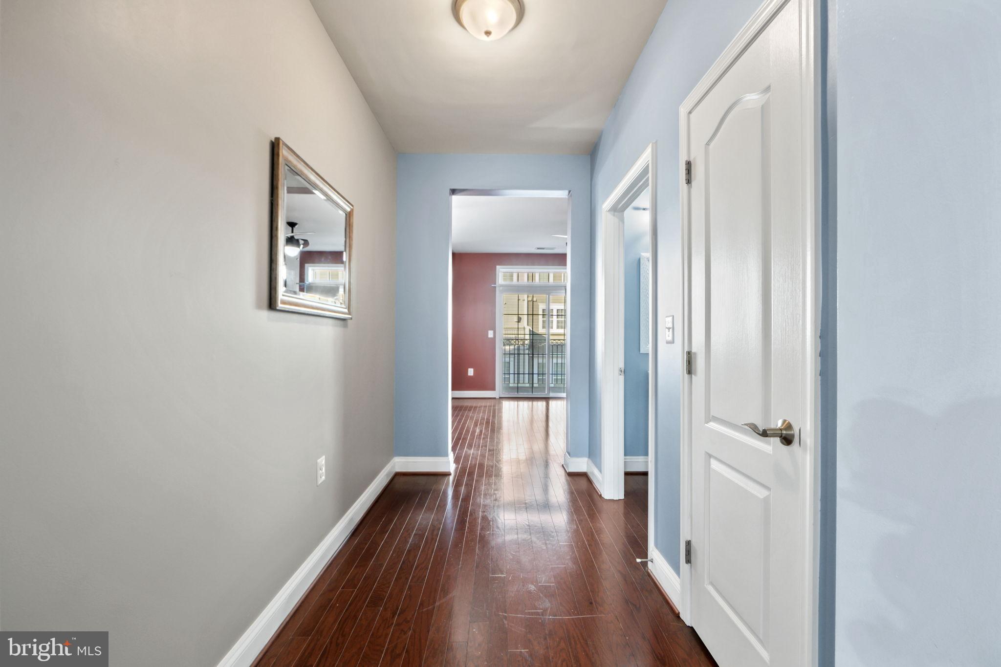 7676 Maple Lawn Boulevard, Unit 2 Fulton, MD 20759 - Photo 24 of 38 Inviting hallway with warm wooden floors.