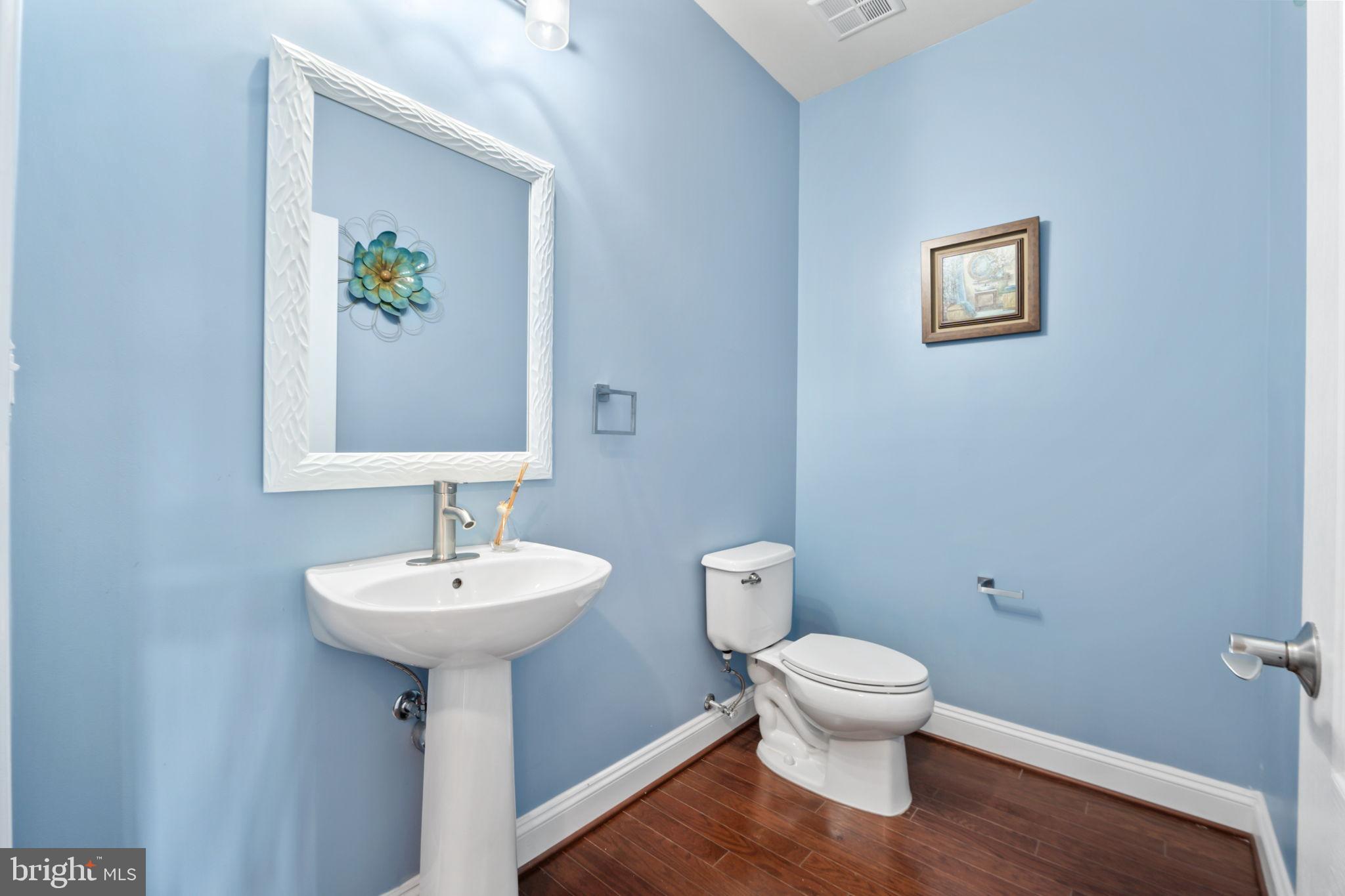 7676 Maple Lawn Boulevard, Unit 2 Fulton, MD 20759 - Photo 25 of 38 Charming powder room with serene blue hues.