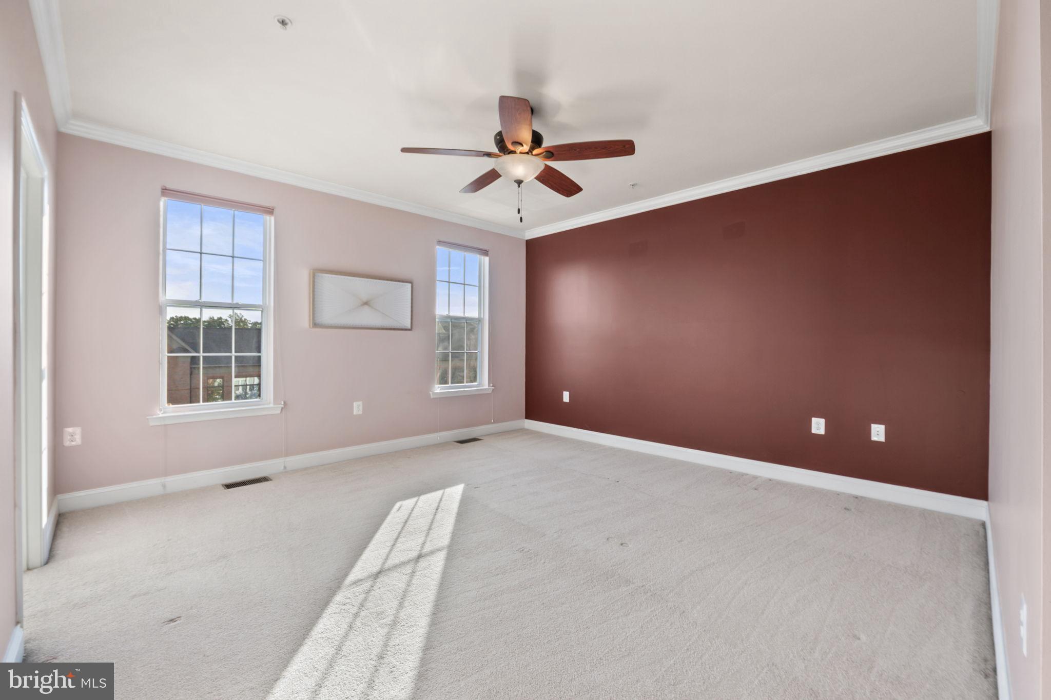 7676 Maple Lawn Boulevard, Unit 2 Fulton, MD 20759 - Photo 27 of 38 Spacious room with warm, inviting hues.