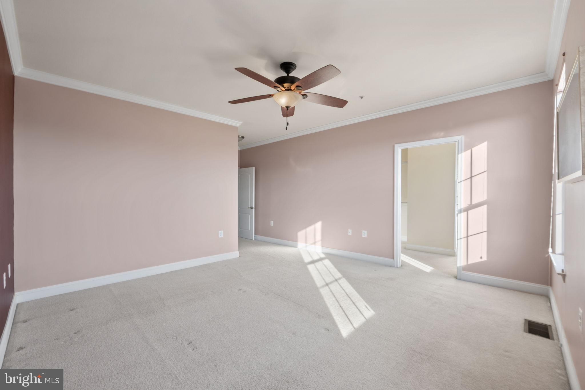 7676 Maple Lawn Boulevard, Unit 2 Fulton, MD 20759 - Photo 28 of 38 Spacious room with soft natural light.