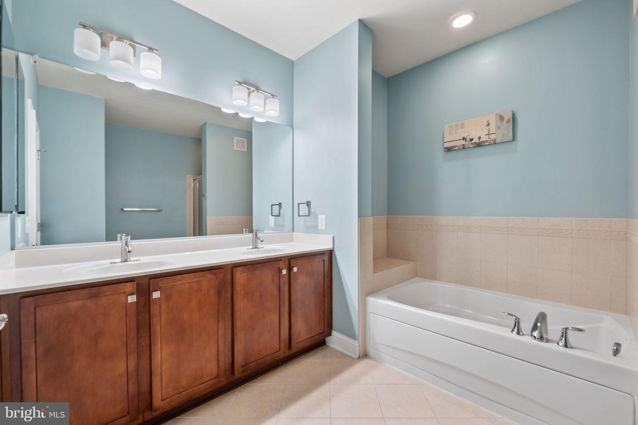 7676 Maple Lawn Boulevard, Unit 2 Fulton, MD 20759 - Photo 30 of 38 Serene bathroom with soothing blue tones.