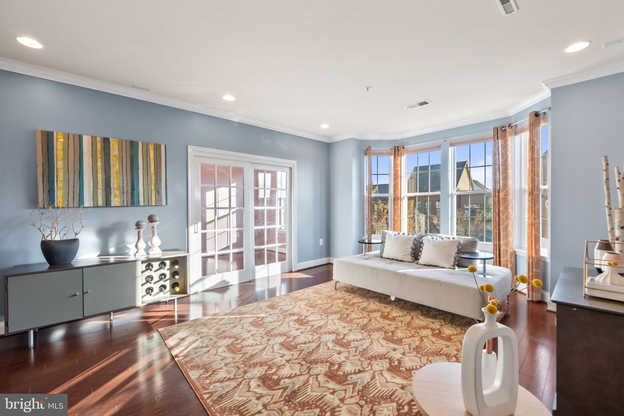 7676 Maple Lawn Boulevard, Unit 2 Fulton, MD 20759 - Photo 8 of 38 Bright and airy living space with scenic views.