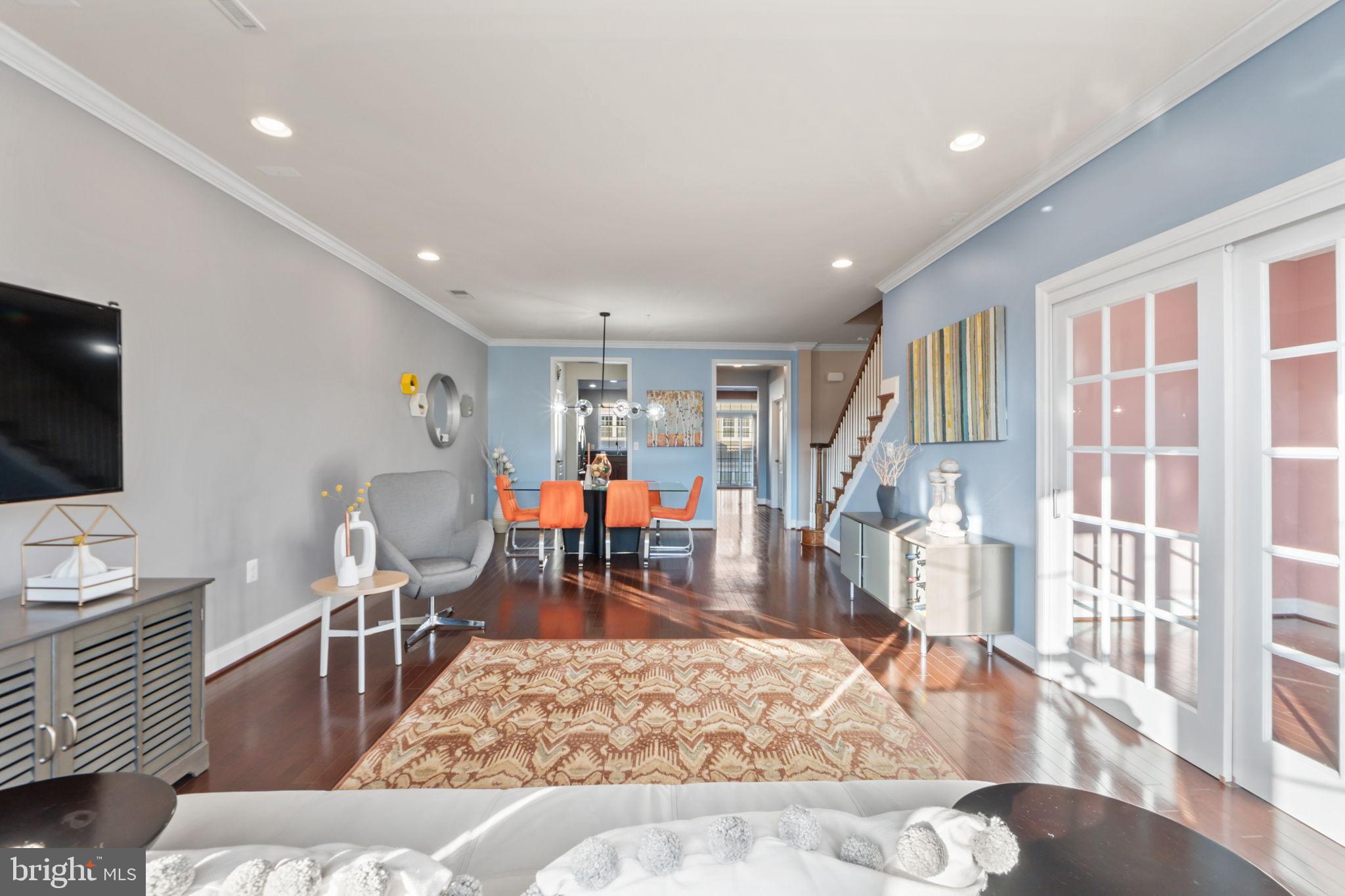 7676 Maple Lawn Boulevard, Unit 2 Fulton, MD 20759 - Photo 10 of 38 Bright and airy open-concept living space.