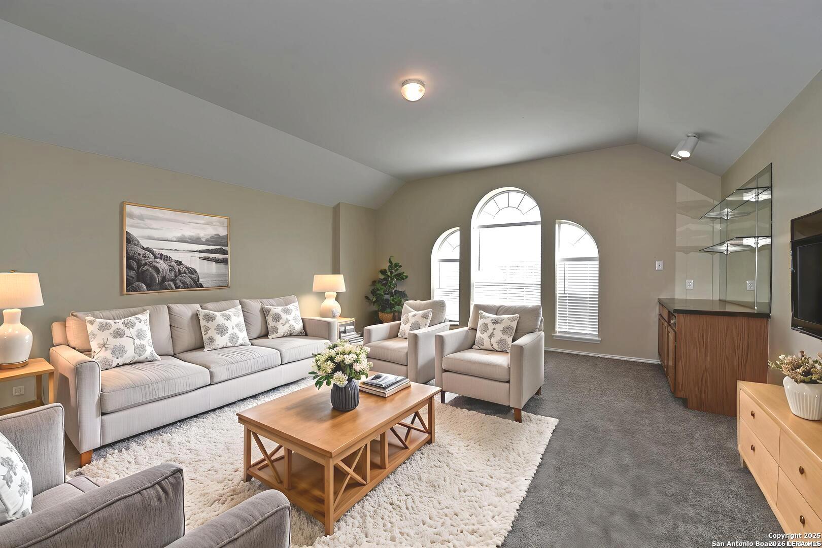 25303 Mesa Ranch San Antonio, TX 78258 - Photo 12 of 54 a living room with furniture and a large window