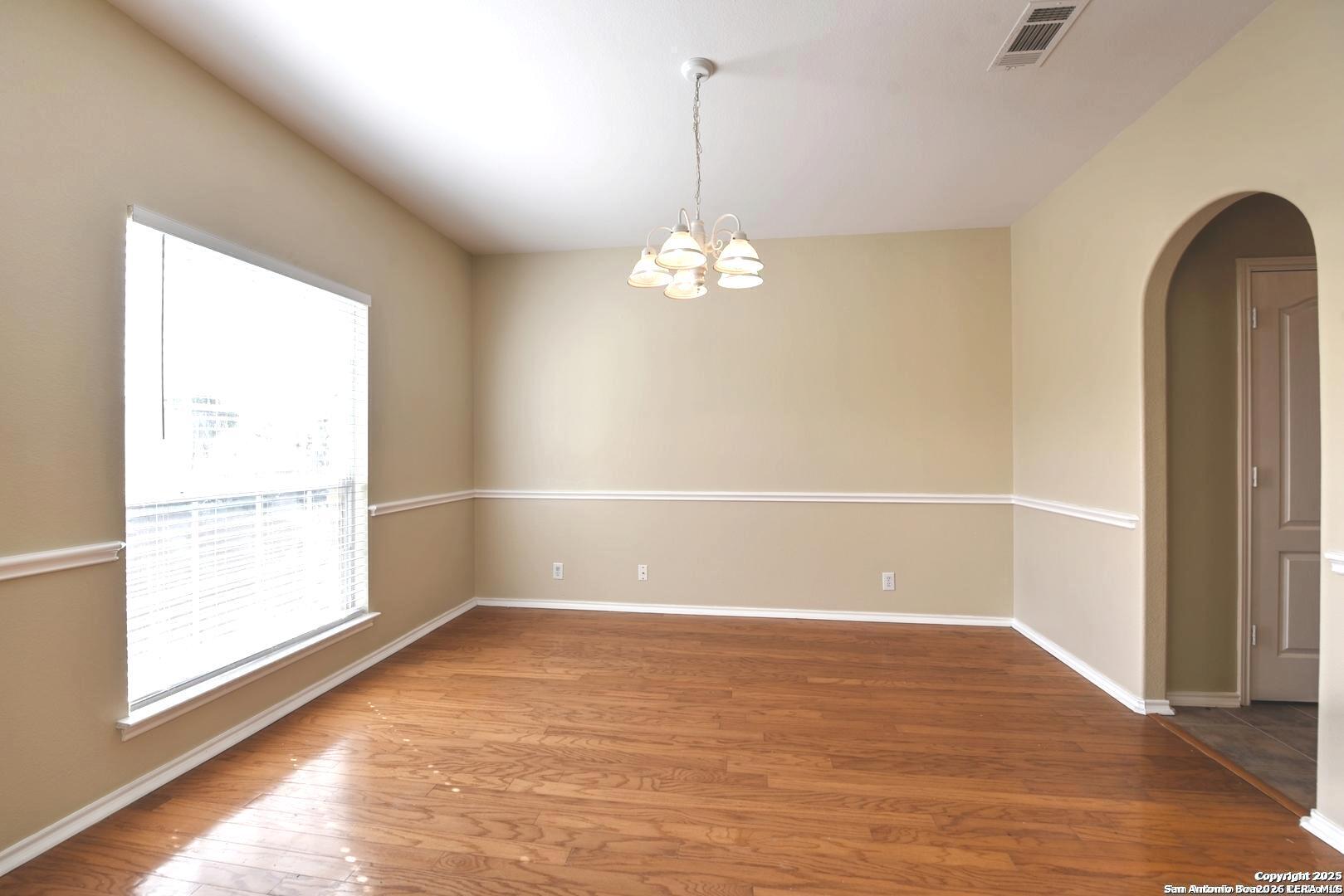 25303 Mesa Ranch San Antonio, TX 78258 - Photo 20 of 54 a view of empty room with wooden floor and fan