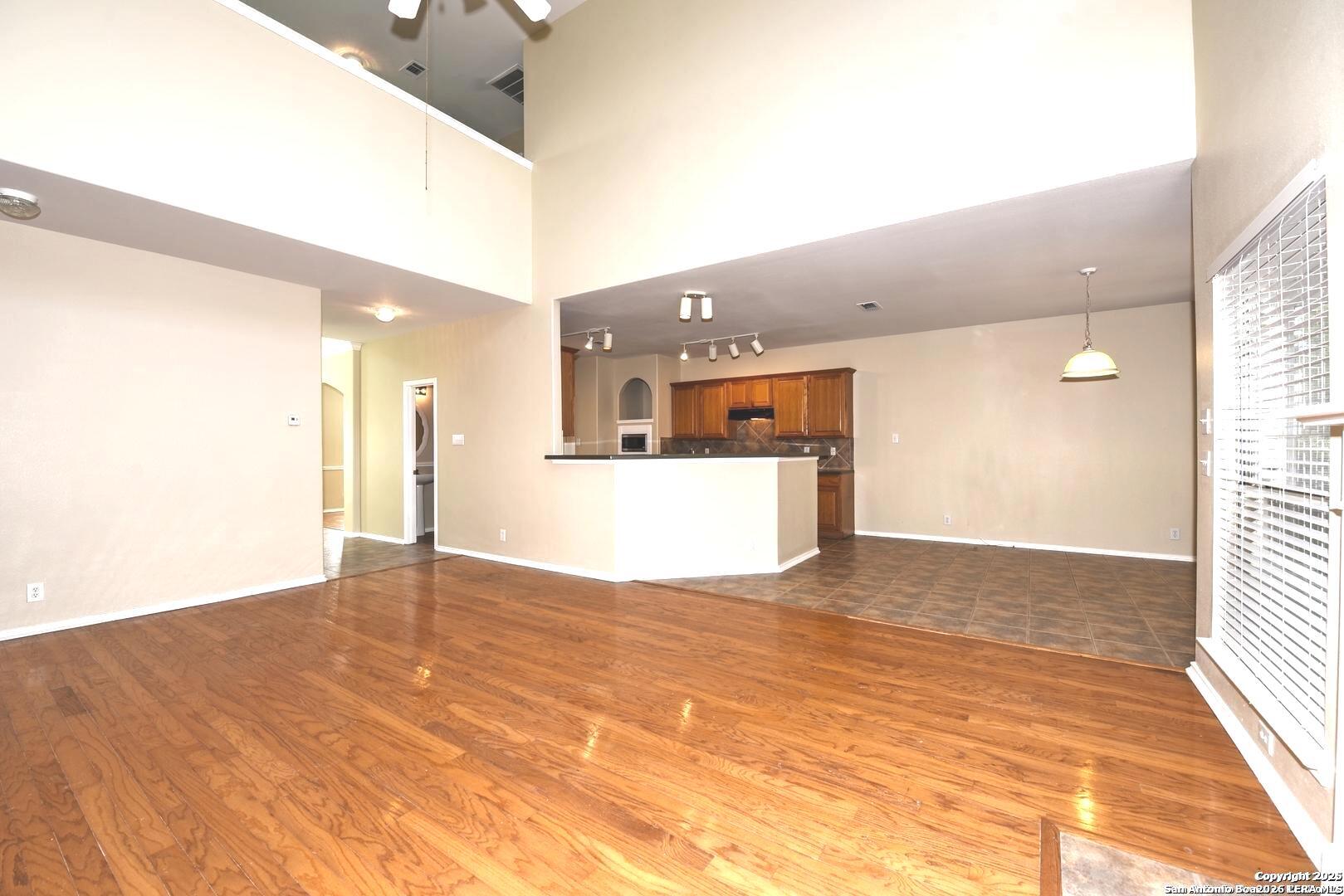 25303 Mesa Ranch San Antonio, TX 78258 - Photo 27 of 54 a view of a kitchen with a sink and a window