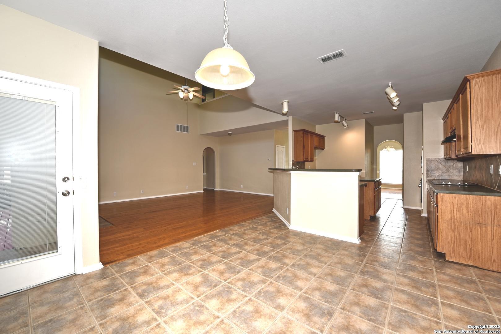 25303 Mesa Ranch San Antonio, TX 78258 - Photo 29 of 54 a view of a kitchen with a sink and cabinets