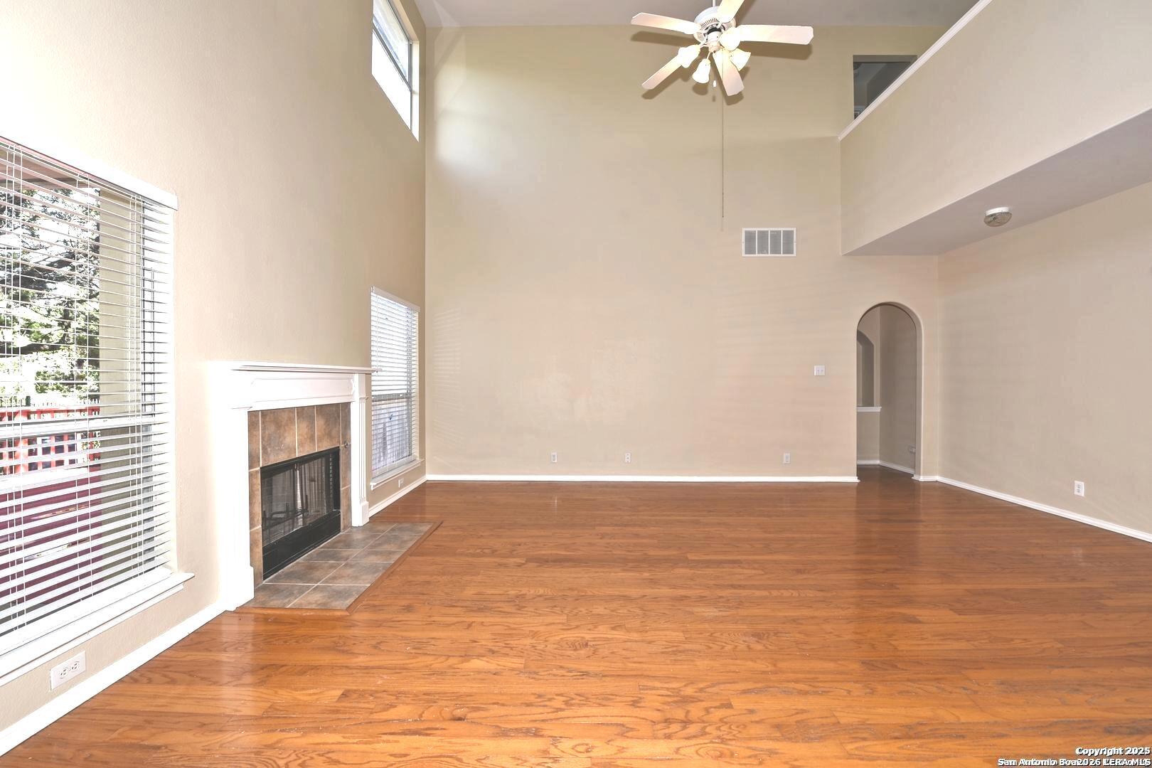 25303 Mesa Ranch San Antonio, TX 78258 - Photo 34 of 54 a view of an empty room with a fireplace and a window