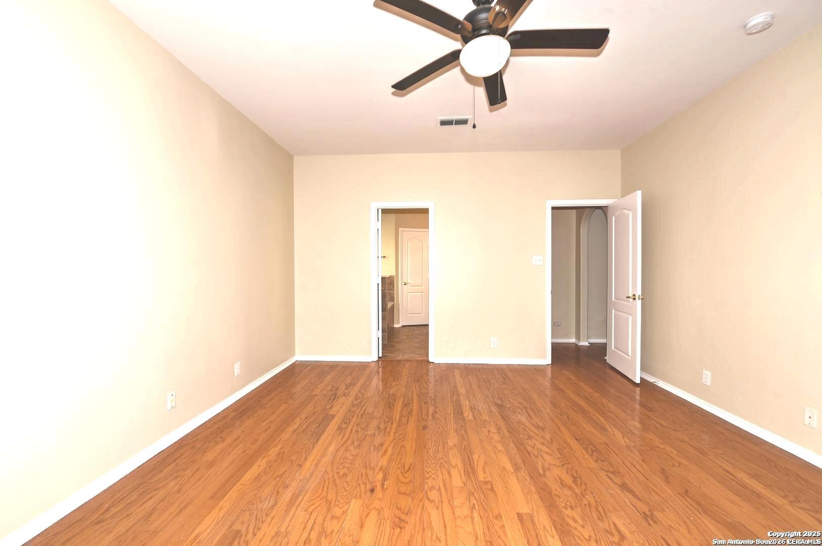 25303 Mesa Ranch San Antonio, TX 78258 - Photo 36 of 54 a view of an empty room and wooden floor