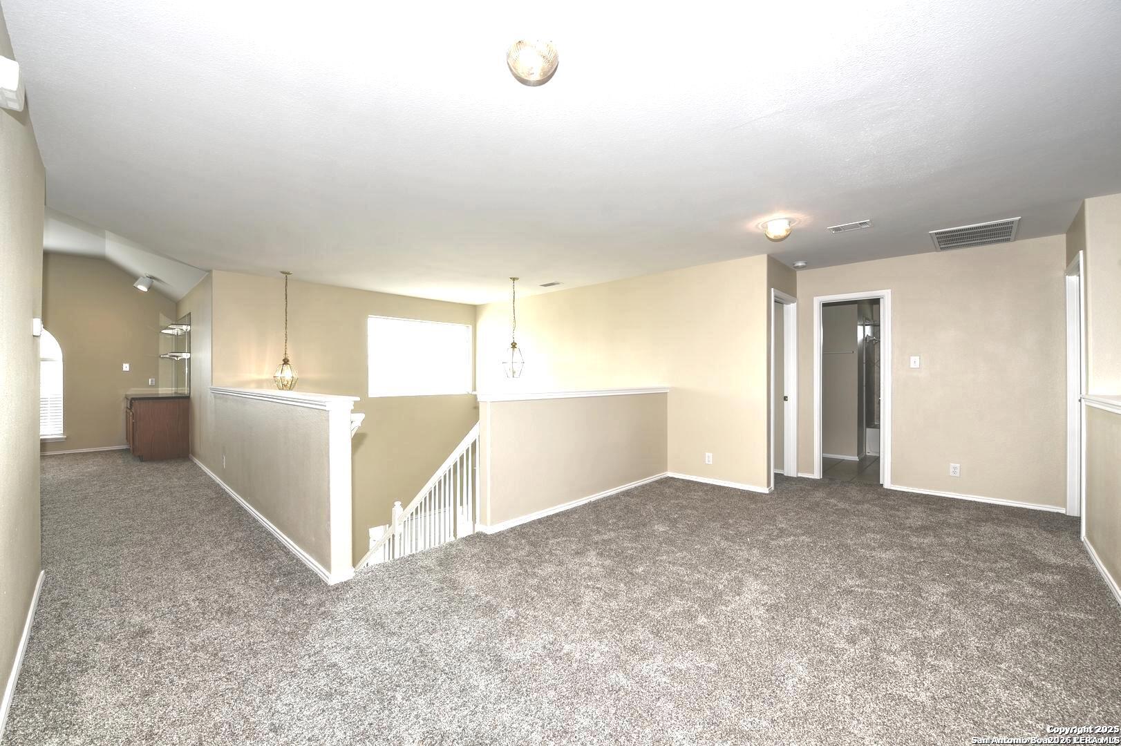 25303 Mesa Ranch San Antonio, TX 78258 - Photo 40 of 54 a view of a big room with windows and closet