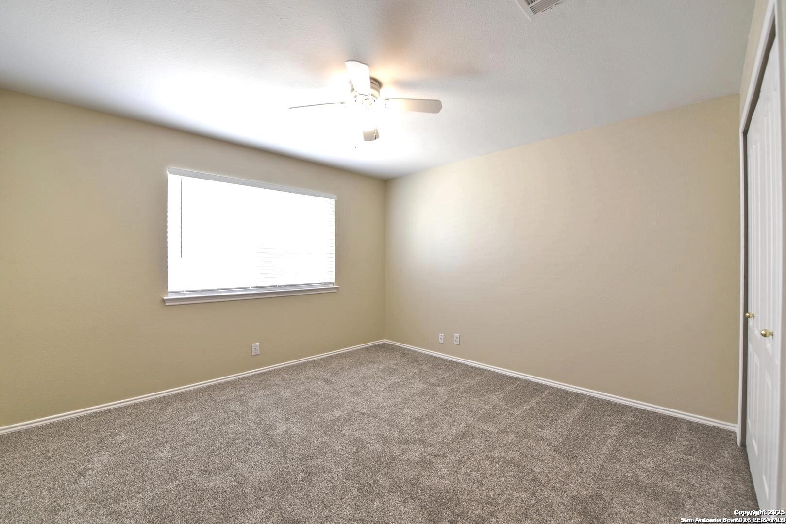 25303 Mesa Ranch San Antonio, TX 78258 - Photo 42 of 54 an empty room with a window