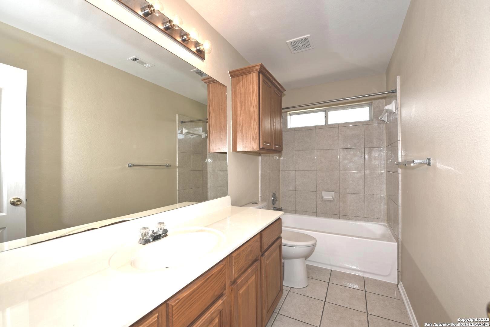 25303 Mesa Ranch San Antonio, TX 78258 - Photo 44 of 54 a bathroom with a sink a toilet and shower