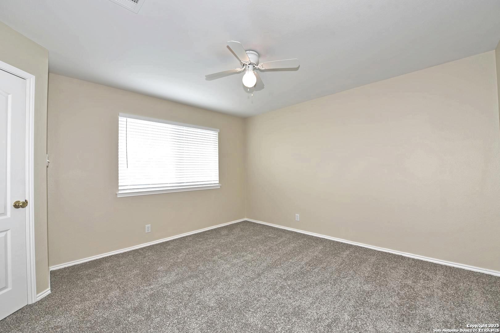 25303 Mesa Ranch San Antonio, TX 78258 - Photo 49 of 54 an empty room with a window