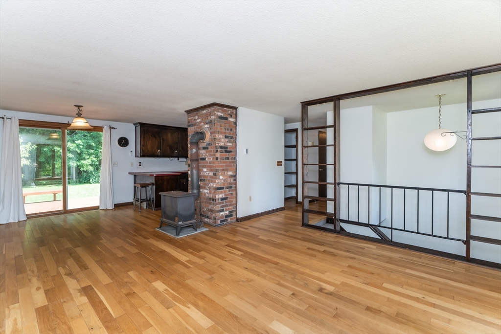 17 Pomeroy Court Amherst, MA 01002 - Photo 13 of 41 a view of a livingroom with a fireplace and window