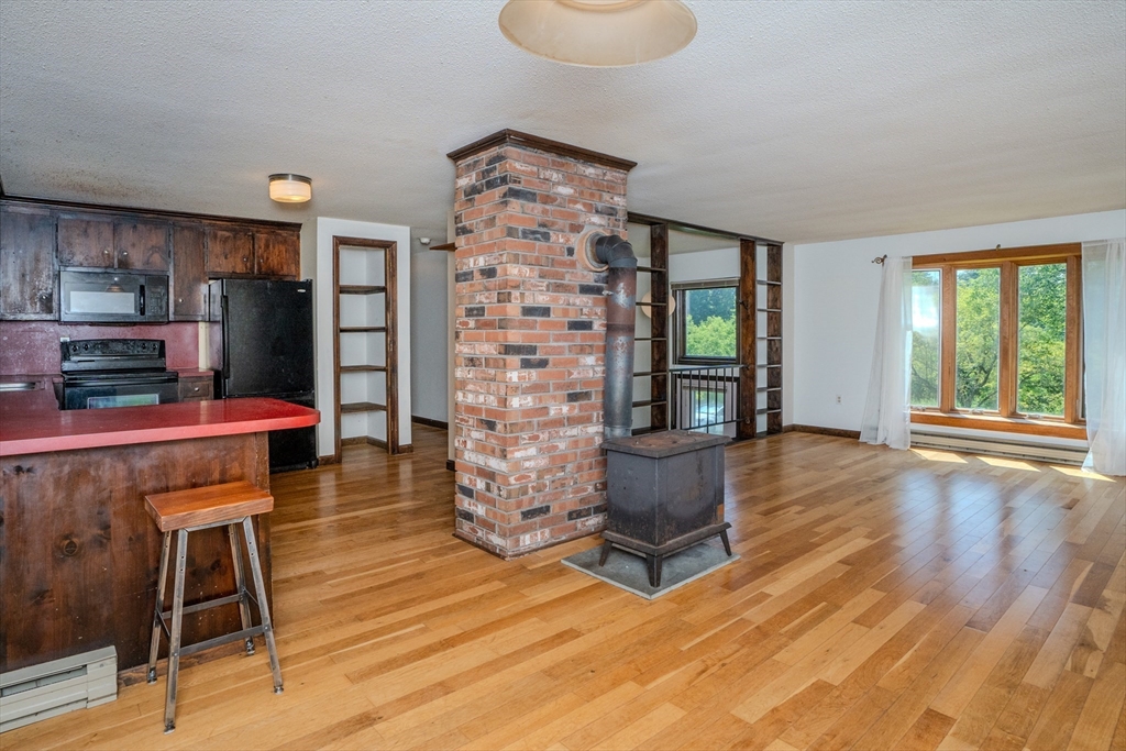 17 Pomeroy Court Amherst, MA 01002 - Photo 15 of 41 a living room with furniture and a wooden floor