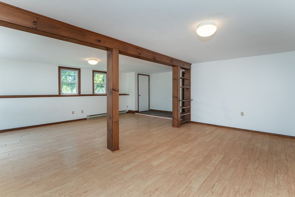 17 Pomeroy Court Amherst, MA 01002 - Photo 30 of 41 a view of an empty room with wooden floor and a window