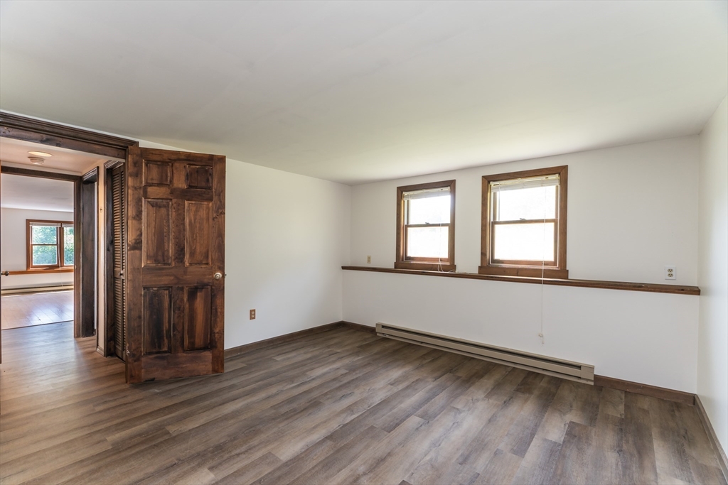 17 Pomeroy Court Amherst, MA 01002 - Photo 32 of 41 an empty room with wooden floor and windows