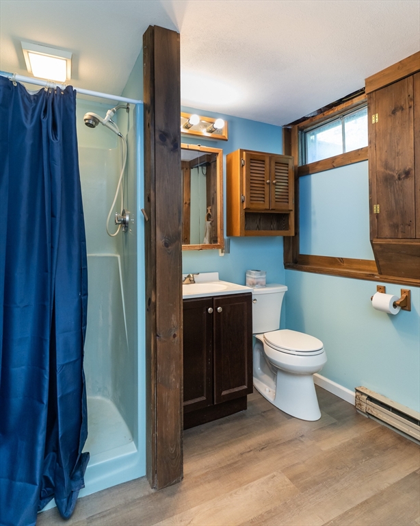17 Pomeroy Court Amherst, MA 01002 - Photo 34 of 41 a bathroom with a toilet sink and mirror