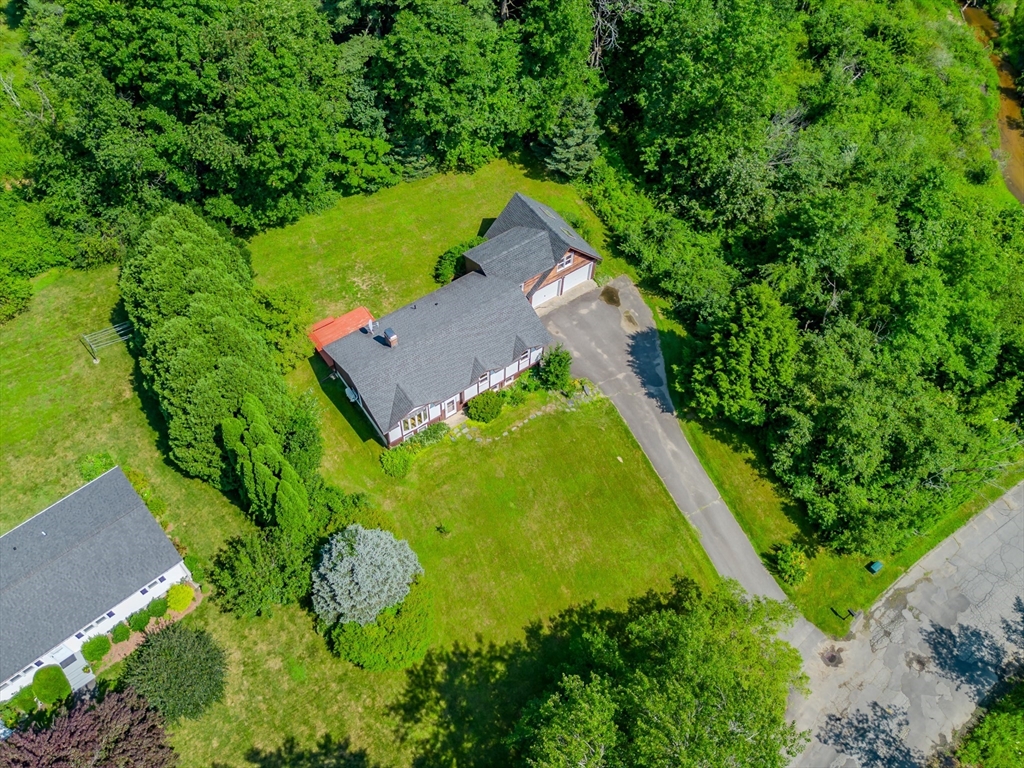 17 Pomeroy Court Amherst, MA 01002 - Photo 6 of 41 an aerial view of residential house with outdoor space and trees all around