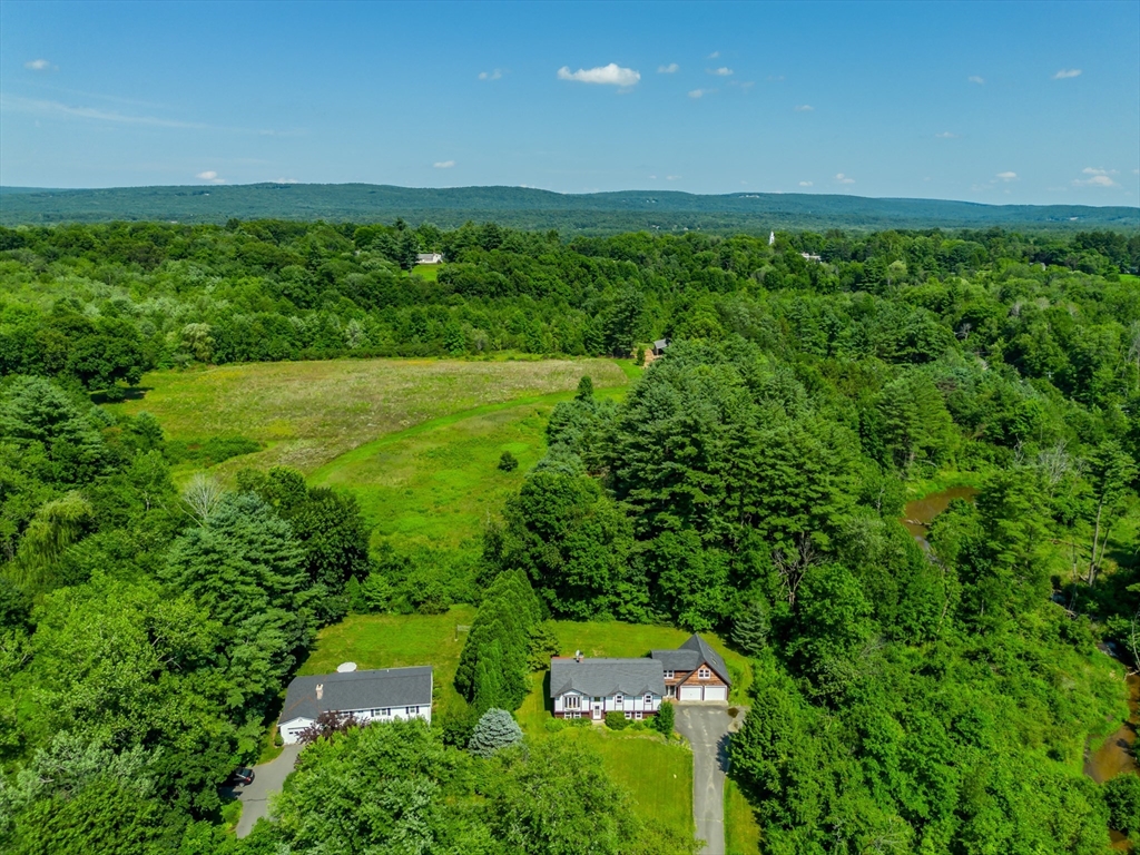 17 Pomeroy Court Amherst, MA 01002 - Photo 7 of 41 a view of a lush green outdoor space with a lake view