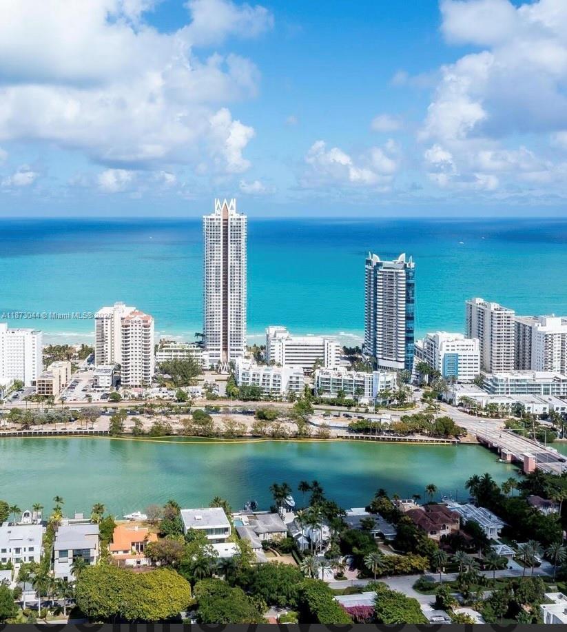 6365 Collins Avenue, Unit 904 Miami Beach, FL 33141 - Photo 2 of 25 a view of a city with tall trees
