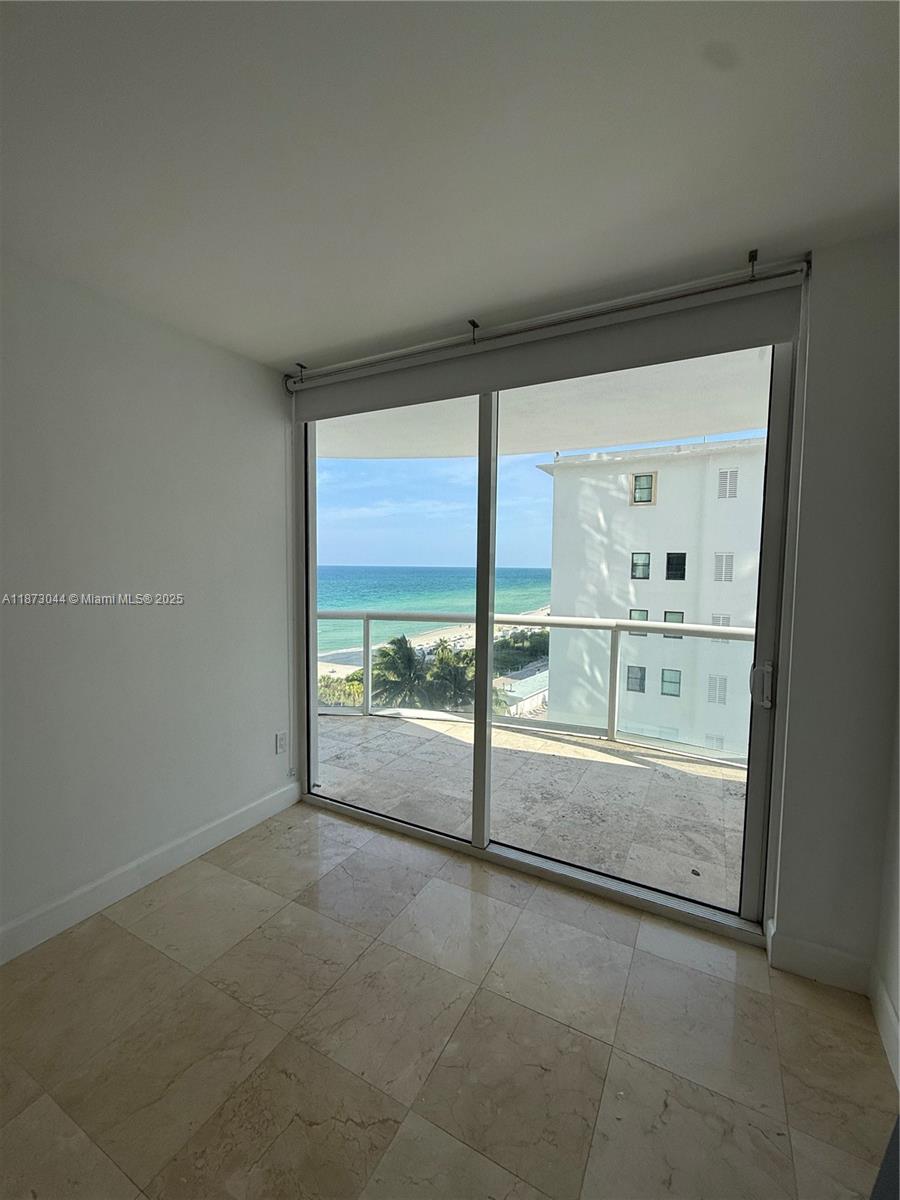6365 Collins Avenue, Unit 904 Miami Beach, FL 33141 - Photo 23 of 25 a view of an empty room with a large window