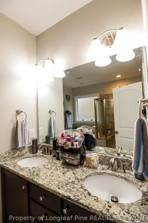 a bathroom with a tub and shower