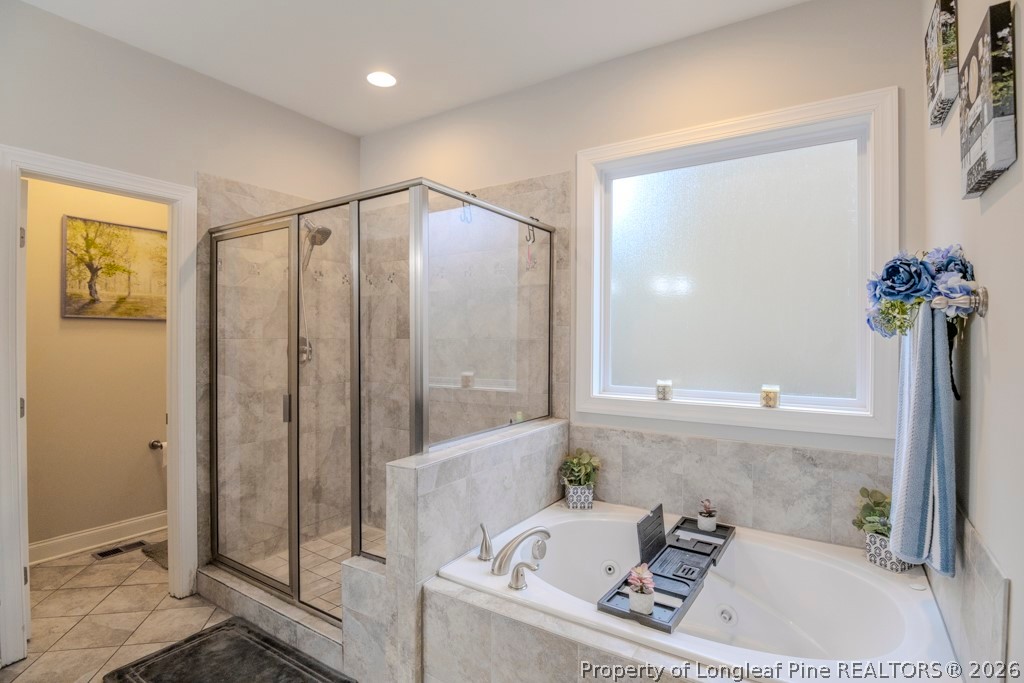 95 Valley Brook Lane Spring Lake, NC 28390 - Photo 17 of 34 a bathroom with a tub and shower