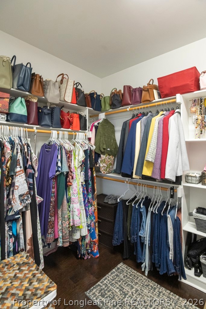 95 Valley Brook Lane Spring Lake, NC 28390 - Photo 18 of 34 a view of walk in closet with clothes and shoes