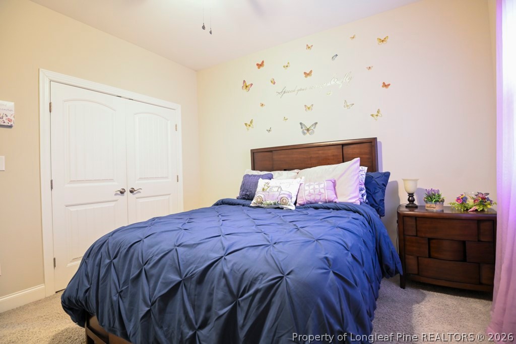 95 Valley Brook Lane Spring Lake, NC 28390 - Photo 24 of 34 a bedroom with a bed and a closet