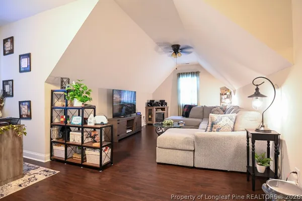 a living room with lots of furniture and a flat screen tv
