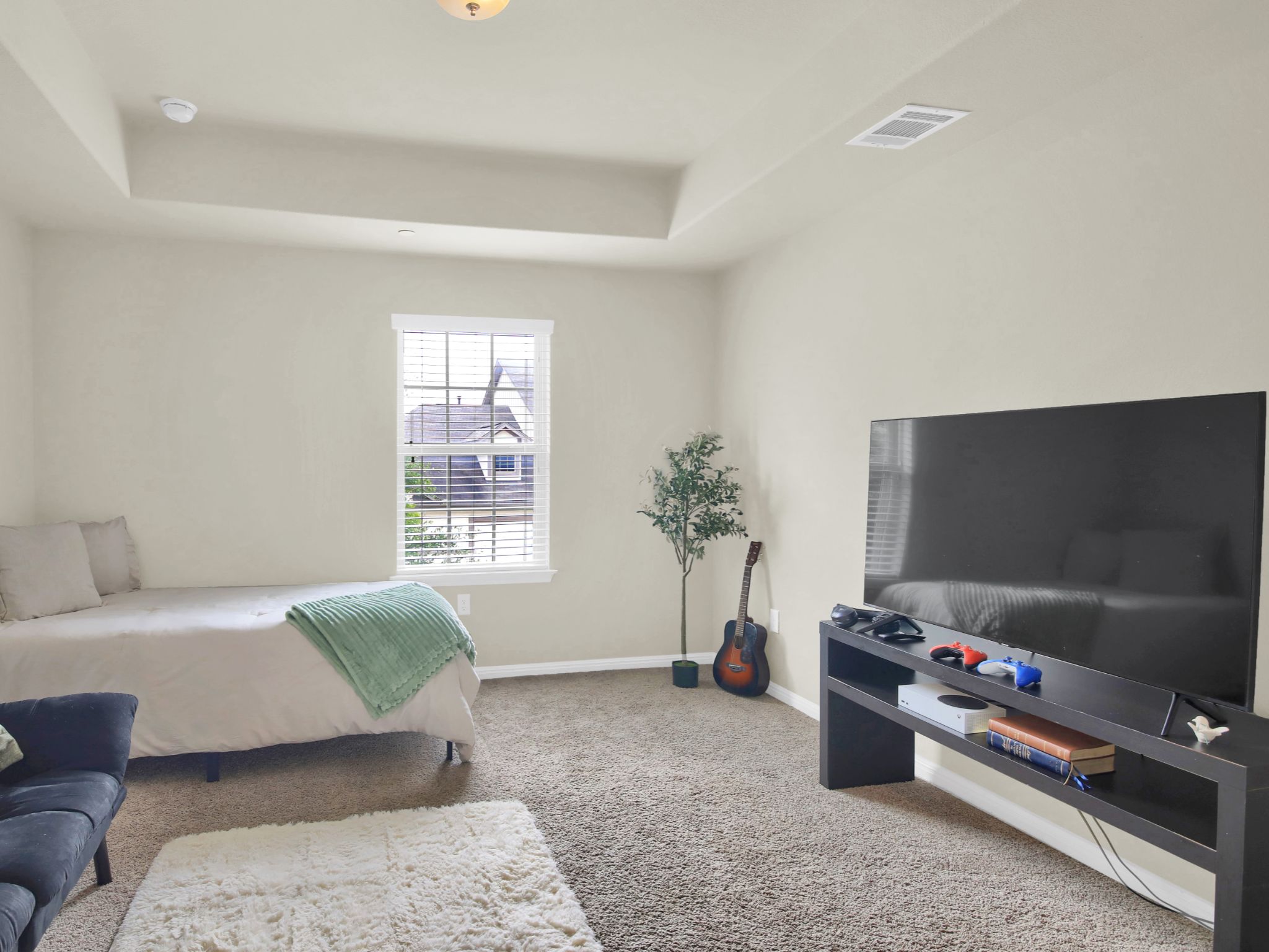 1600 Airedale Road, Unit 2601 Austin, TX 78748 - Photo 21 of 26 A quiet bedroom retreat features ample natural light and a tray ceiling.