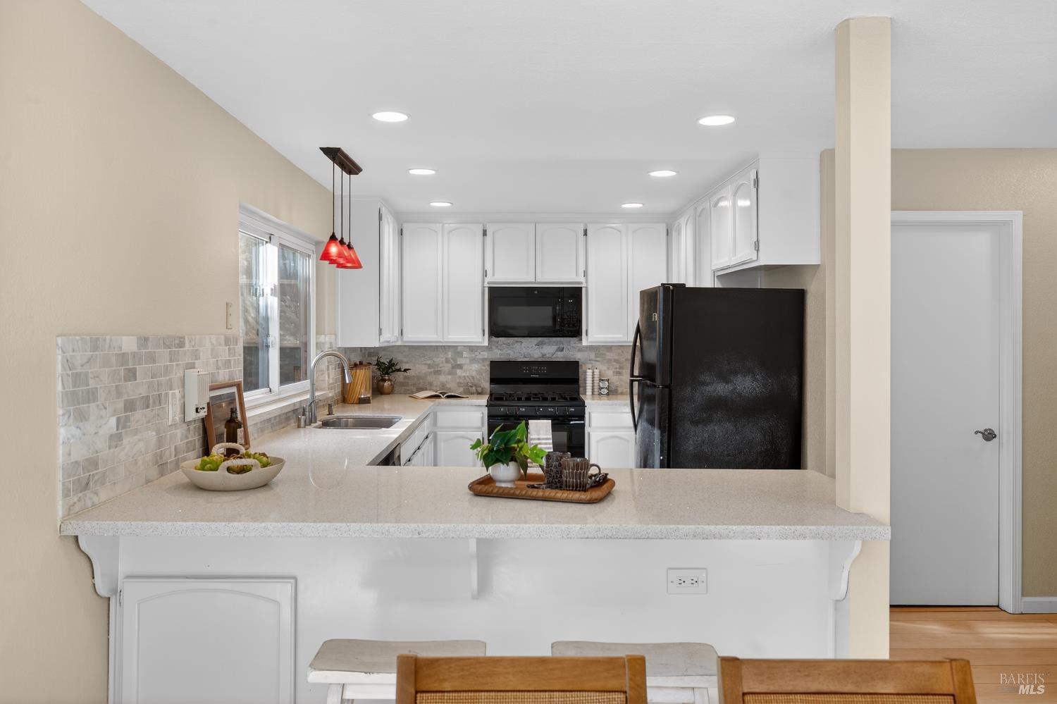 985 Hacienda Circle Rohnert Park, CA 94928 - Photo 11 of 36 a kitchen with a refrigerator a stove and a sink