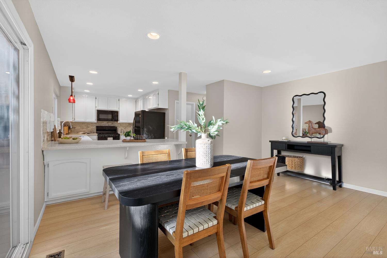 985 Hacienda Circle Rohnert Park, CA 94928 - Photo 13 of 36 a dining room with furniture and wooden floor