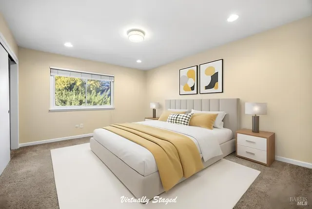 a bedroom with a large bed and a window