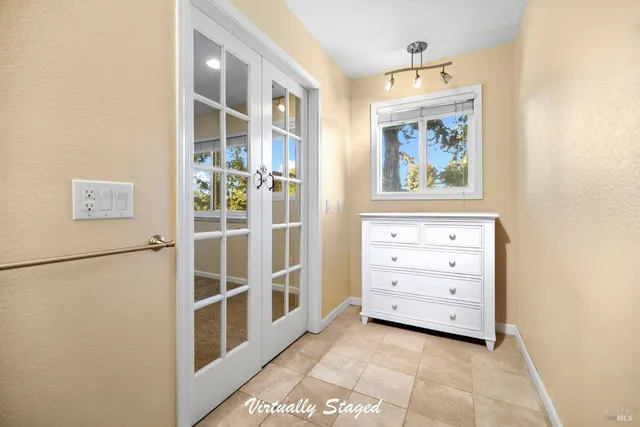 a view of a bedroom with bed and hallway